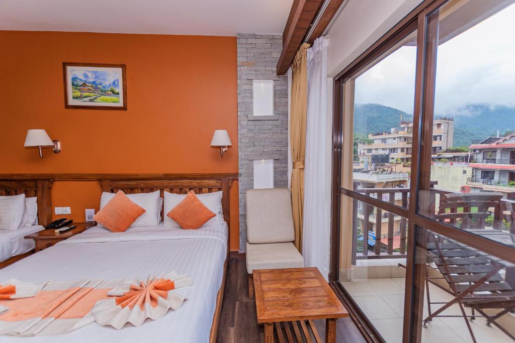 Letto o letti in una camera di Pokhara Batika