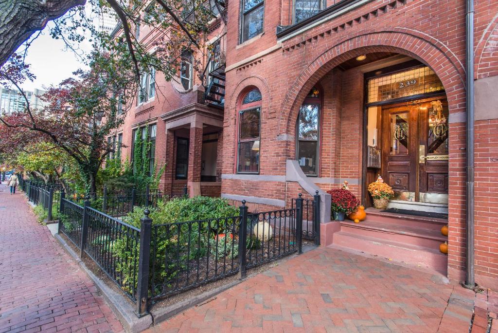 a brick house with a black fence in front of it at Copley House in Boston