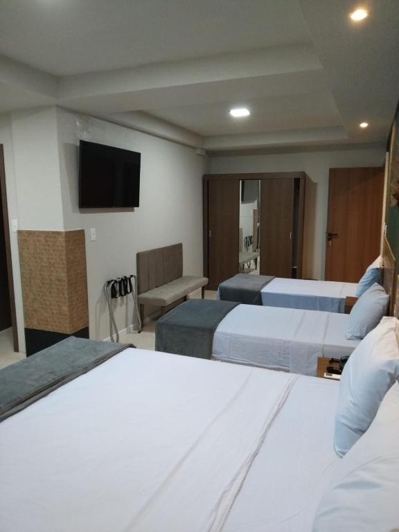 Postel nebo postele na pokoji v ubytování Hotel do Largo Manaus