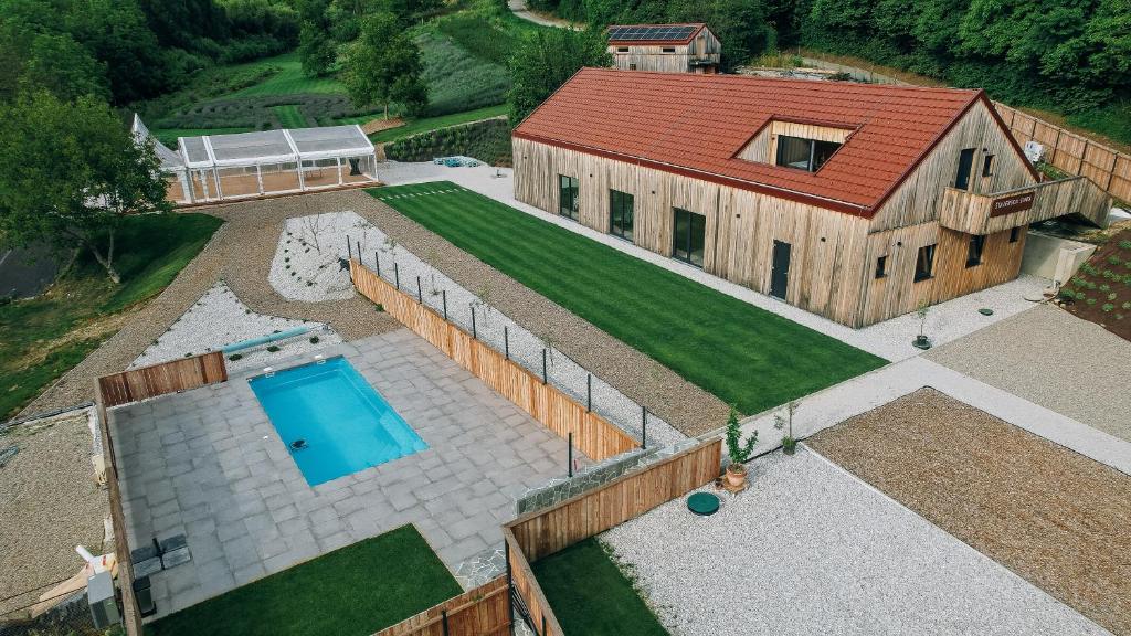an aerial view of a house with a swimming pool at Štajerska sivka - Jacuzzi & Savna in Maribor