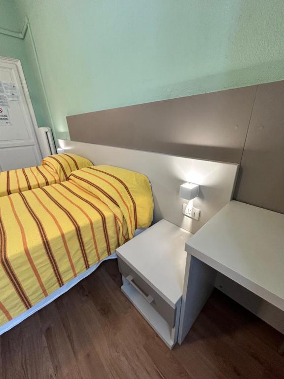 Postel nebo postele na pokoji v ubytování Hotel Barone