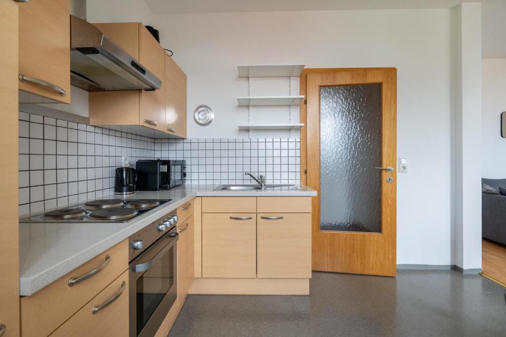Kuchyň nebo kuchyňský kout v ubytování FarawayHomes Studio Fohnsdorf #9