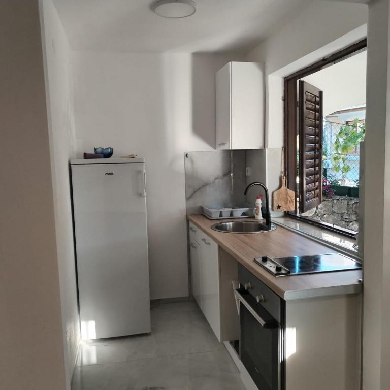 Kuchyň nebo kuchyňský kout v ubytování Mondeno apartments