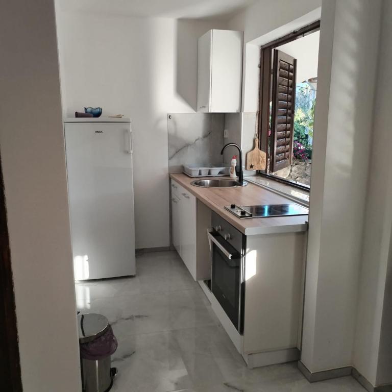 Kuchyň nebo kuchyňský kout v ubytování Mondeno apartments