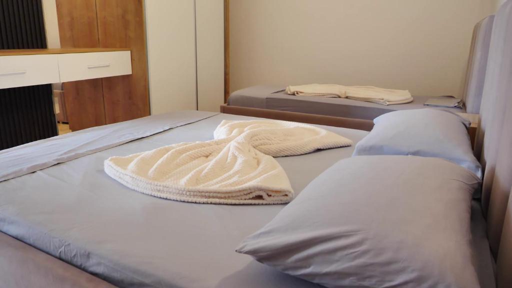 Postel nebo postele na pokoji v ubytování Hotel Laura