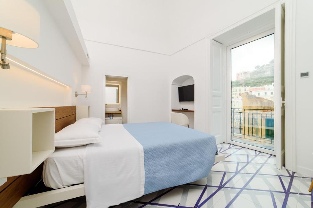 Postel nebo postele na pokoji v ubytování Palazzo Colavolpe Suite
