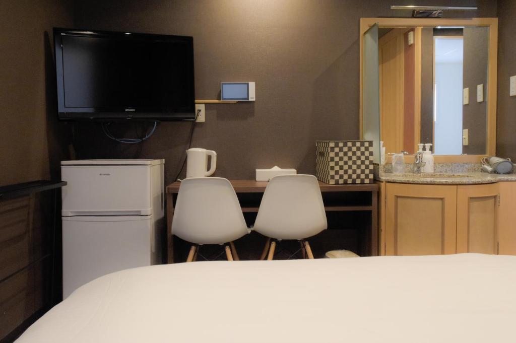 Kuchyň nebo kuchyňský kout v ubytování Stay HOTEL