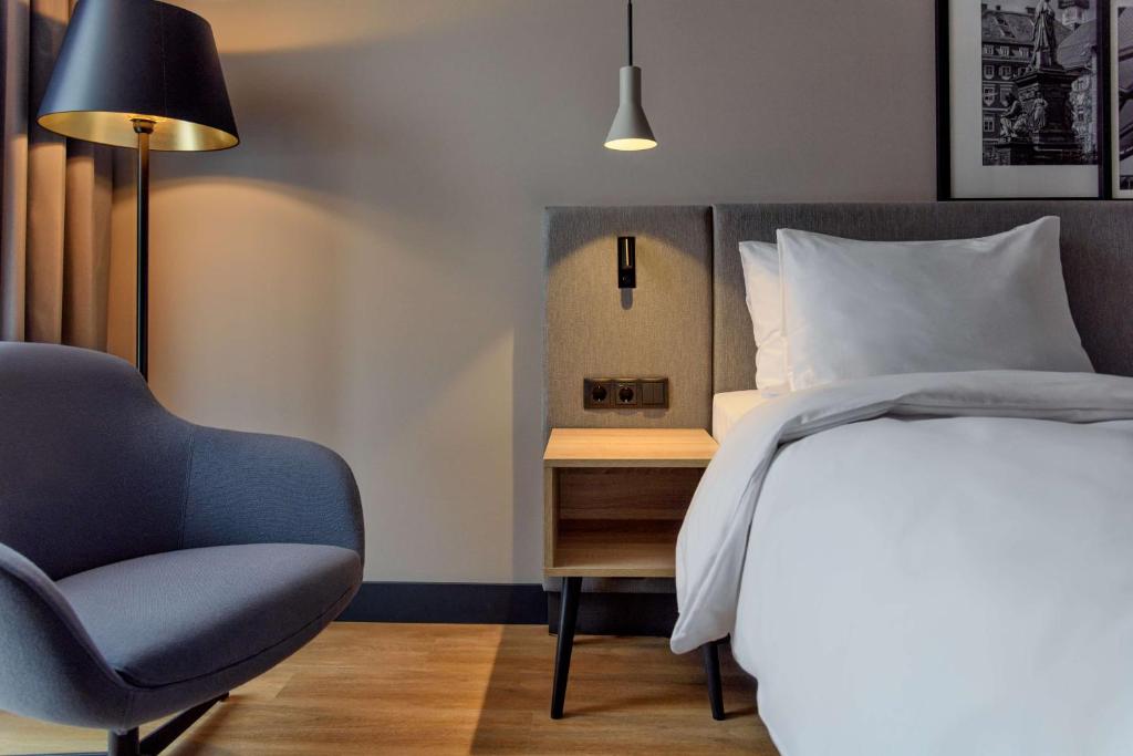 Voodi või voodid majutusasutuse Radisson Hotel Graz toas