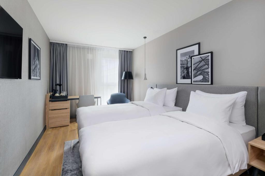 Voodi või voodid majutusasutuse Radisson Hotel Graz toas