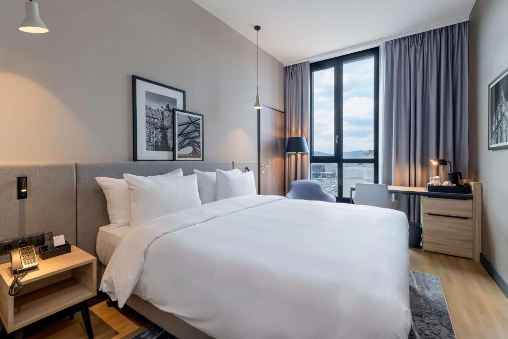 Postel nebo postele na pokoji v ubytování Radisson Hotel Graz