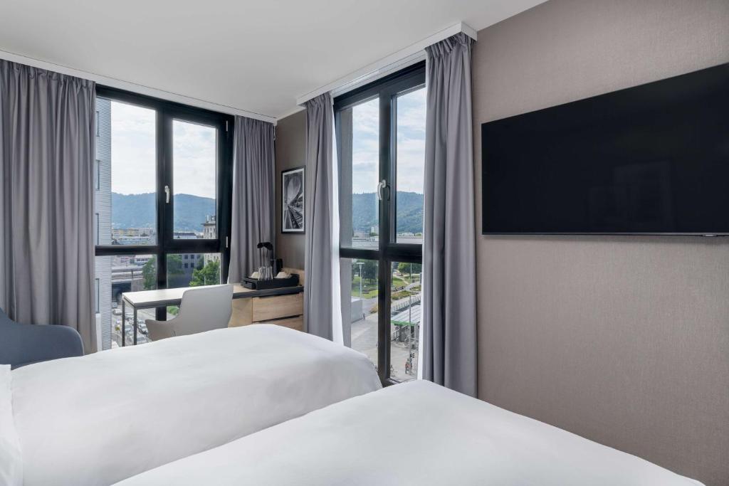 Voodi või voodid majutusasutuse Radisson Hotel Graz toas