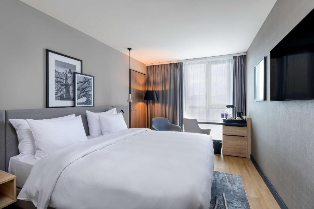 Voodi või voodid majutusasutuse Radisson Hotel Graz toas