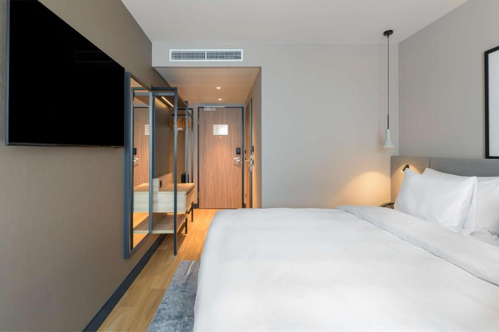 Voodi või voodid majutusasutuse Radisson Hotel Graz toas