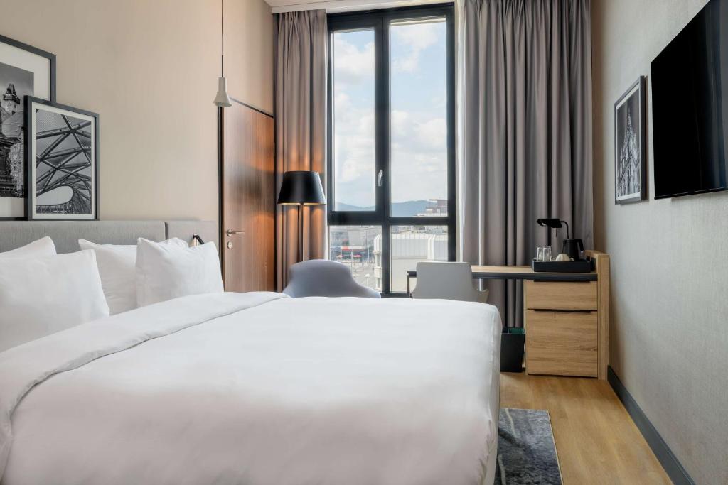 Voodi või voodid majutusasutuse Radisson Hotel Graz toas