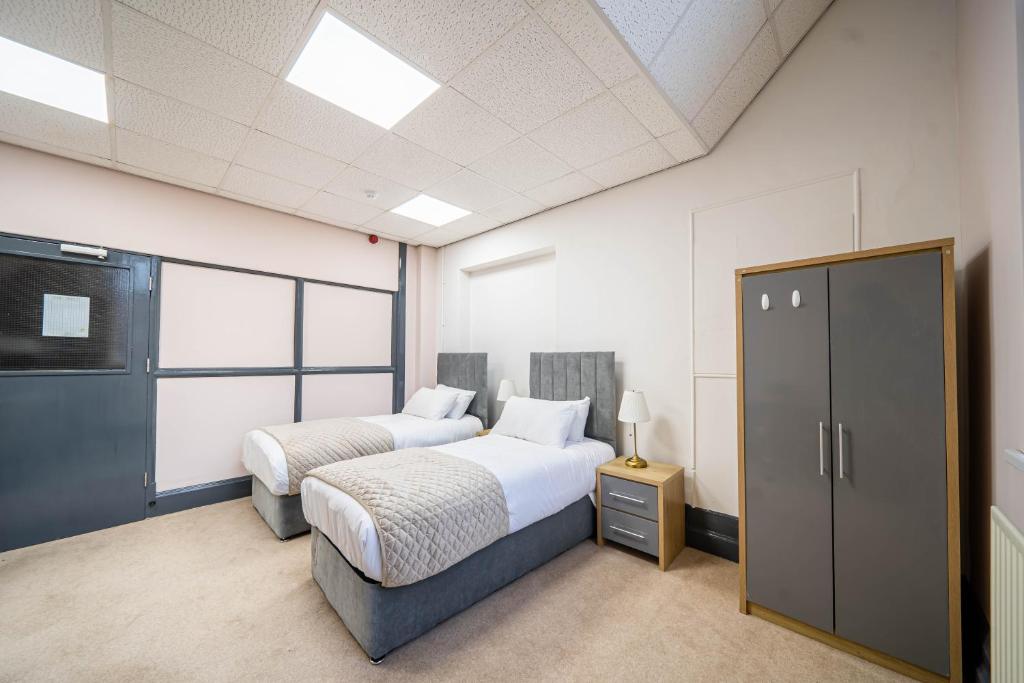 Postel nebo postele na pokoji v ubytování Bessemer Rooms