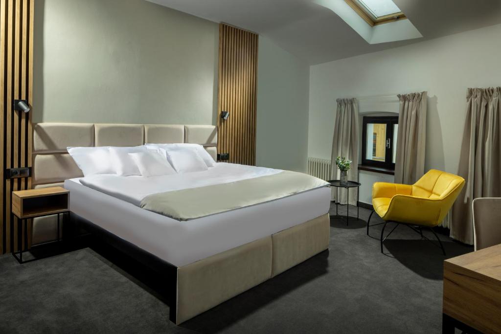 Postel nebo postele na pokoji v ubytování Hotel Savorsky
