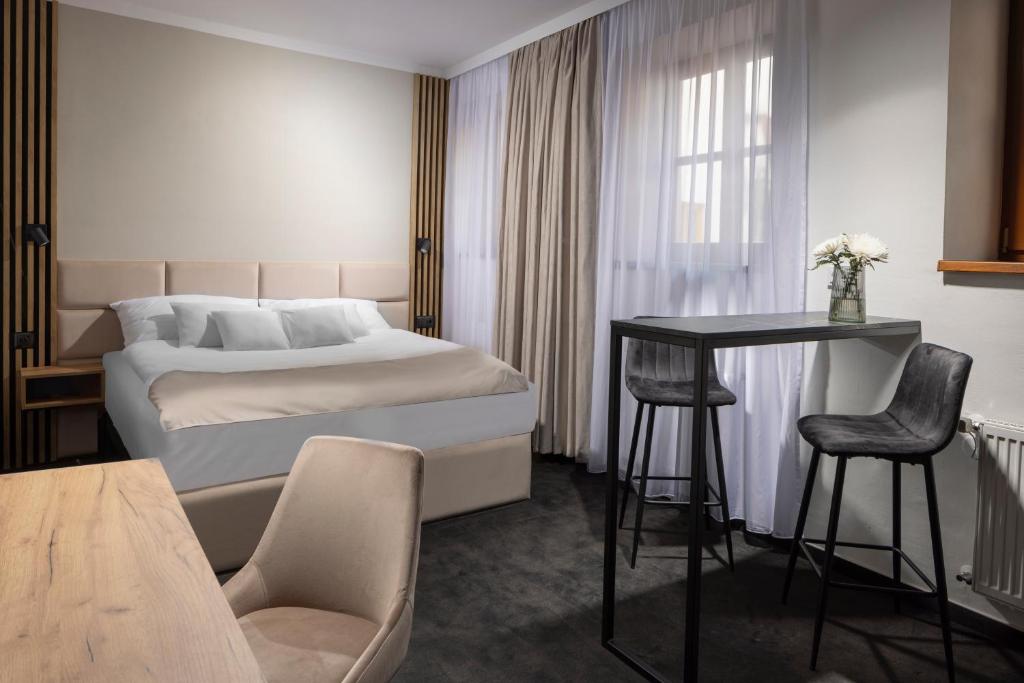 Postel nebo postele na pokoji v ubytování Hotel Savorsky