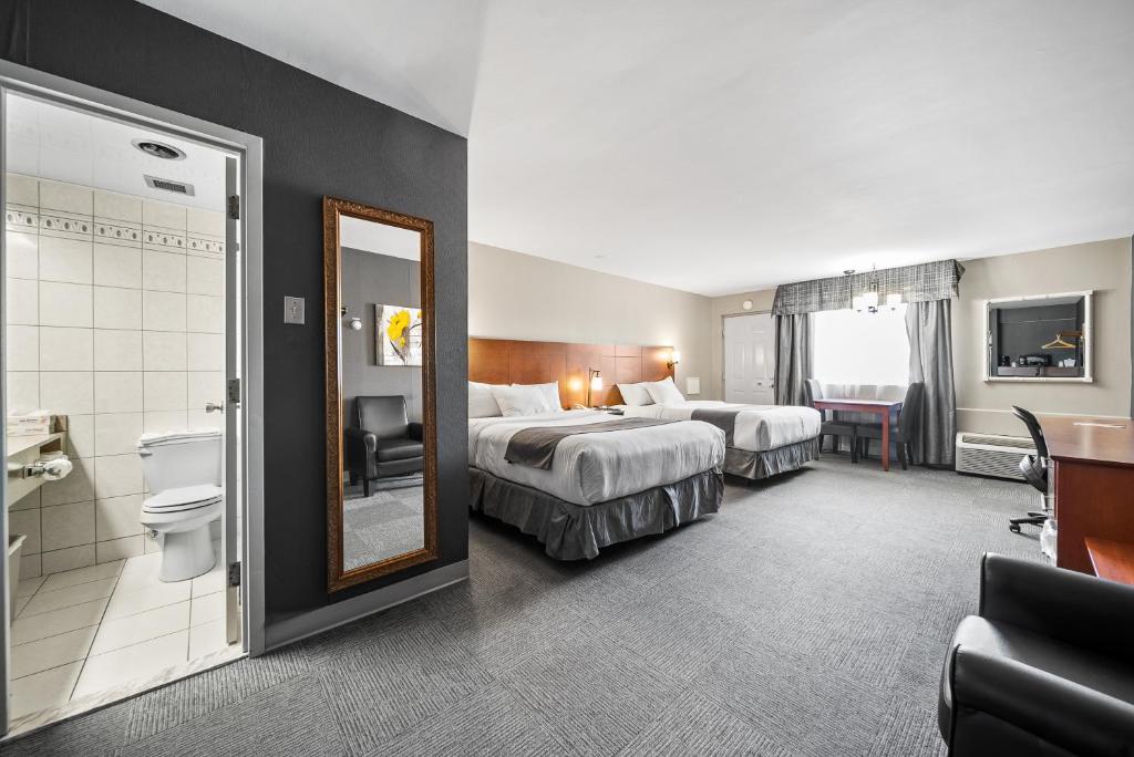 Postel nebo postele na pokoji v ubytování Hotel-Motel Coconut
