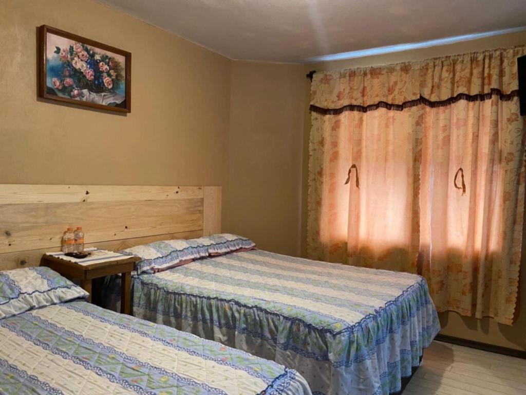 Postel nebo postele na pokoji v ubytování Posada Lindavista