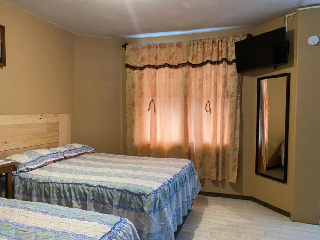 Postel nebo postele na pokoji v ubytování Posada Lindavista