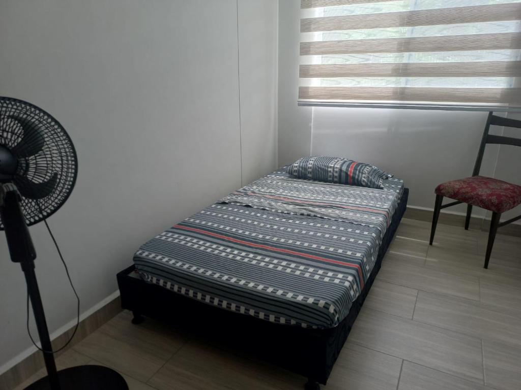 Postel nebo postele na pokoji v ubytování Apartamento en Ricaurte, Arrayanes de Peñaliza
