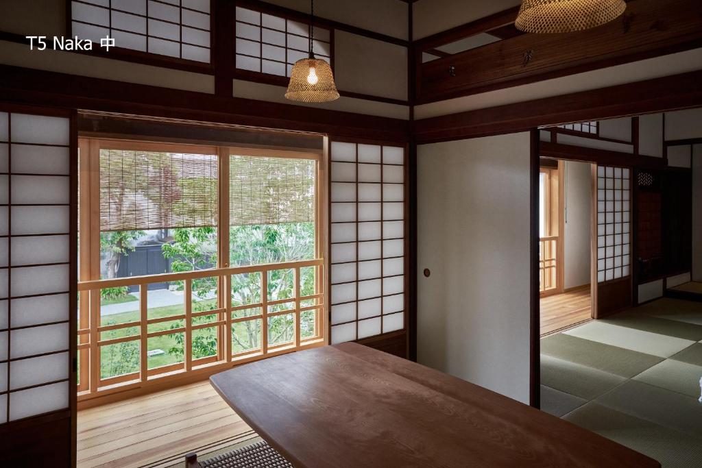 Postel nebo postele na pokoji v ubytování 滔々 倉敷民藝館南の宿 toutou, Mingeikan Minami no Yado