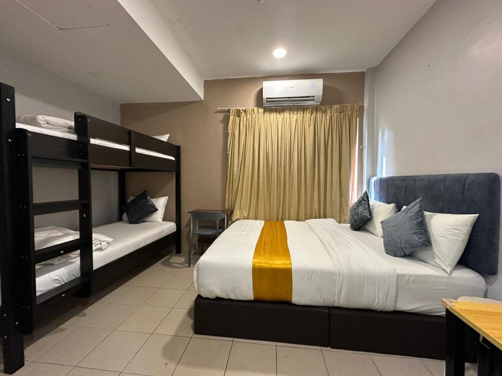 Postel nebo postele na pokoji v ubytování SS Grey Hotel 2