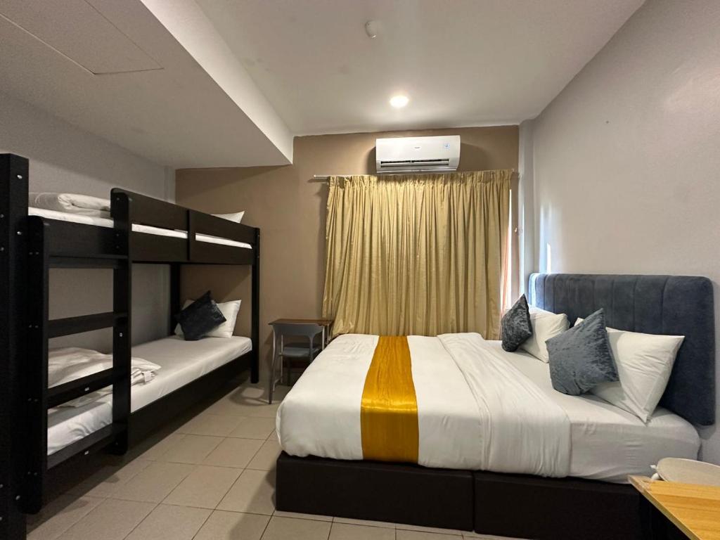 Postel nebo postele na pokoji v ubytování SS Grey Hotel 2