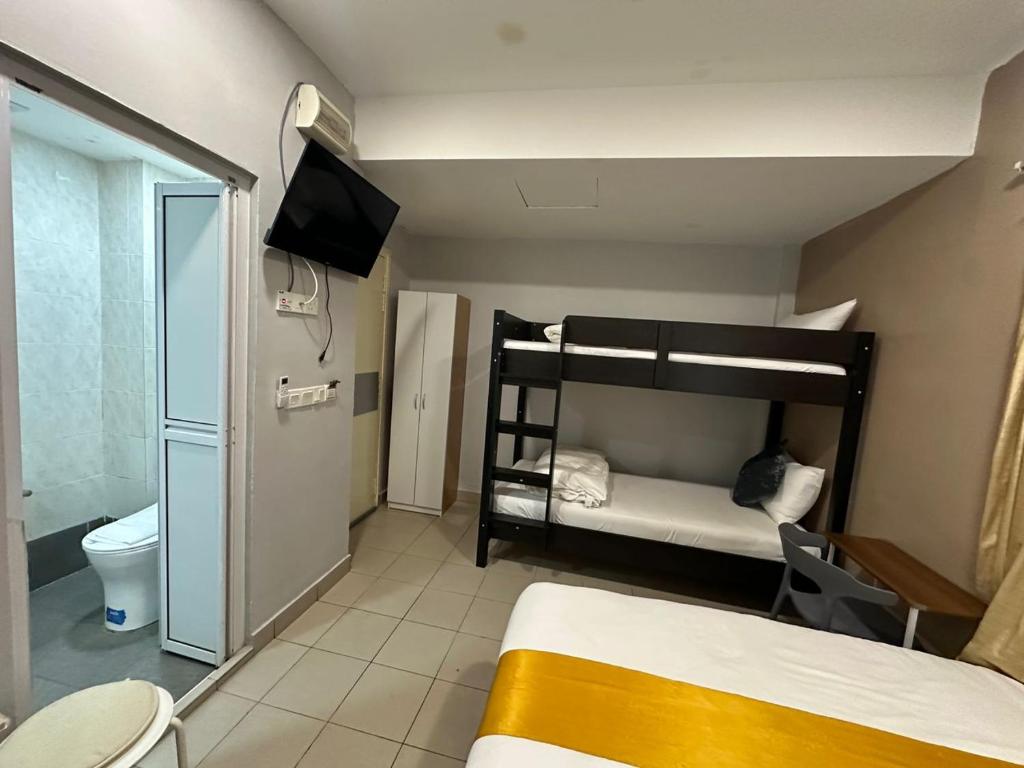 Postel nebo postele na pokoji v ubytování SS Grey Hotel 2
