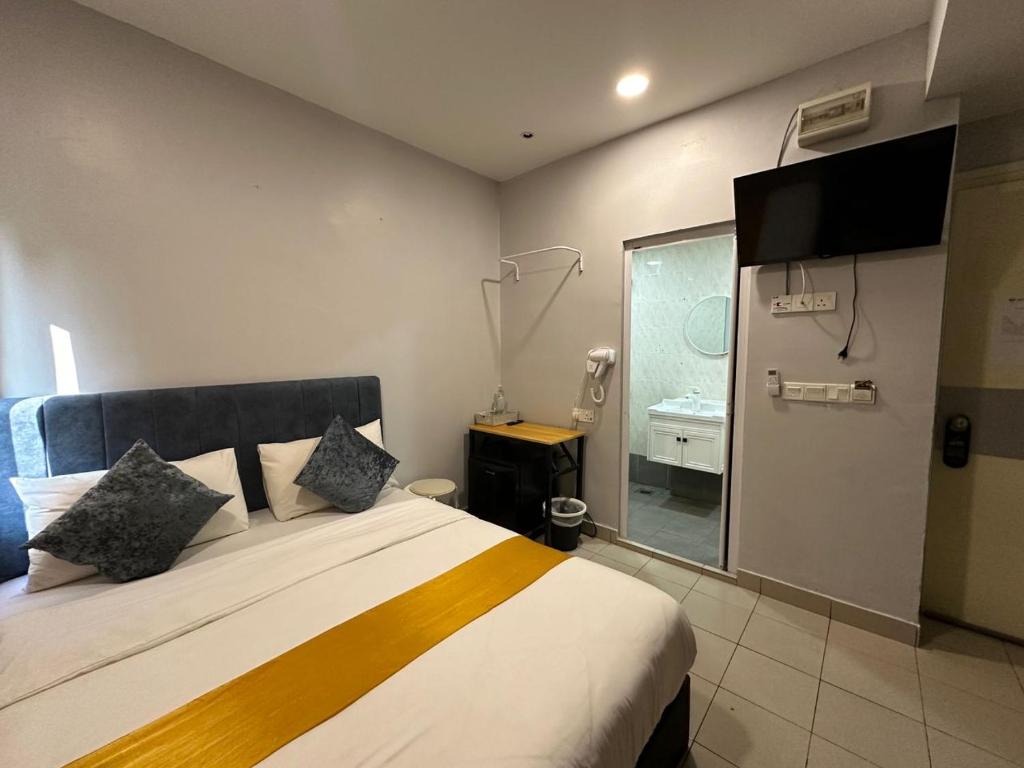 Postel nebo postele na pokoji v ubytování SS Grey Hotel 2