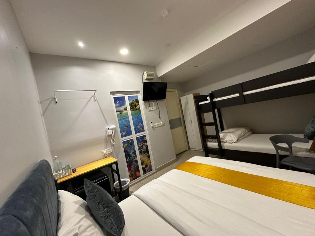 Postel nebo postele na pokoji v ubytování SS Grey Hotel 2
