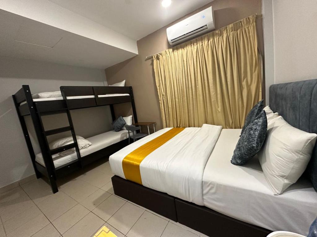 Postel nebo postele na pokoji v ubytování SS Grey Hotel 2