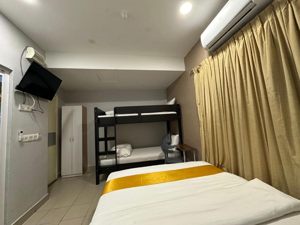 Postel nebo postele na pokoji v ubytování SS Grey Hotel 2