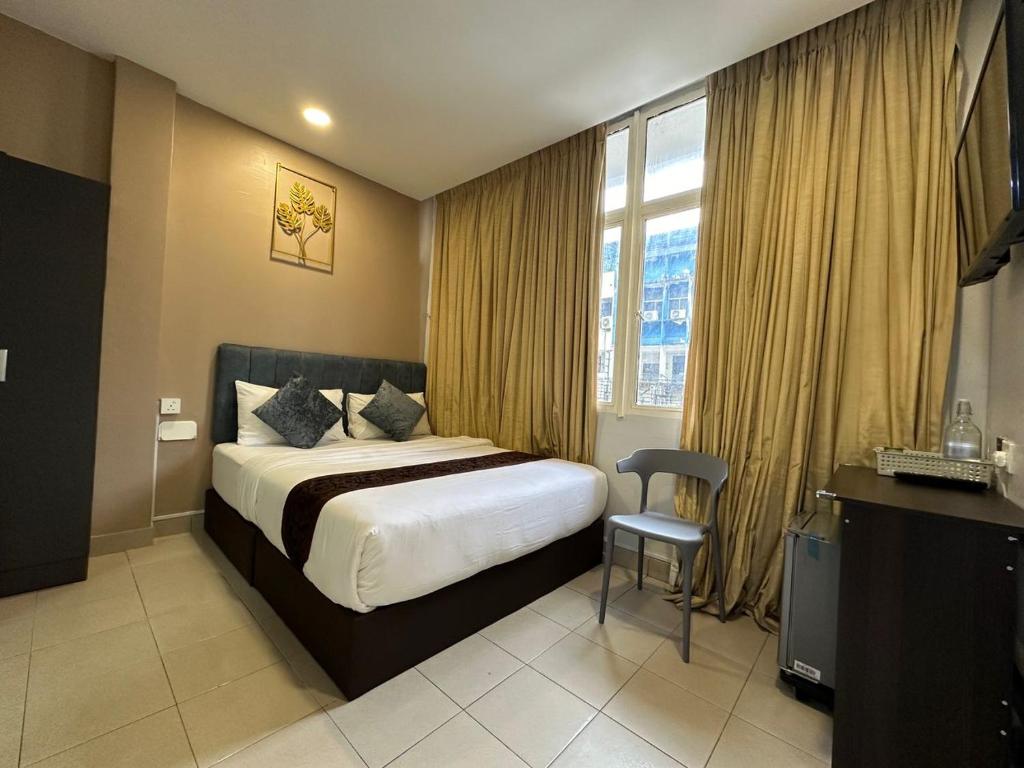 Postel nebo postele na pokoji v ubytování SS Grey Hotel 2