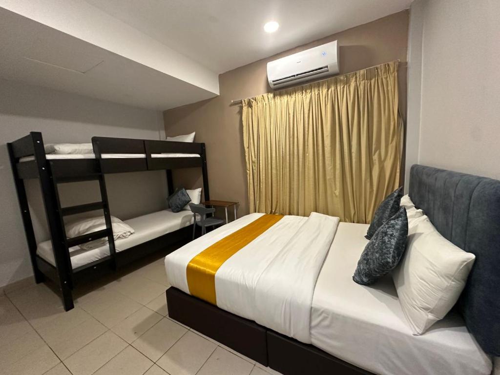 Postel nebo postele na pokoji v ubytování SS Grey Hotel 2