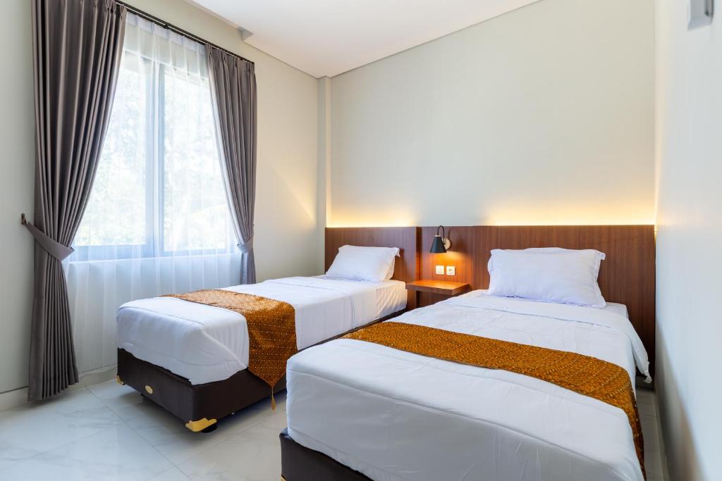 Postel nebo postele na pokoji v ubytování Fazza Homes