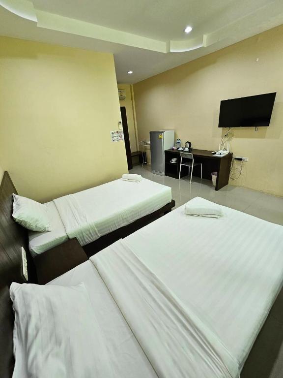 Postel nebo postele na pokoji v ubytování Samran Resort