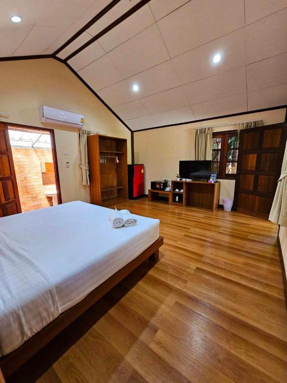 Postel nebo postele na pokoji v ubytování Samran Resort
