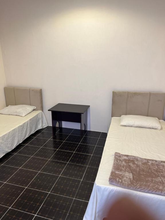 Postel nebo postele na pokoji v ubytování Tagalradia Hostel