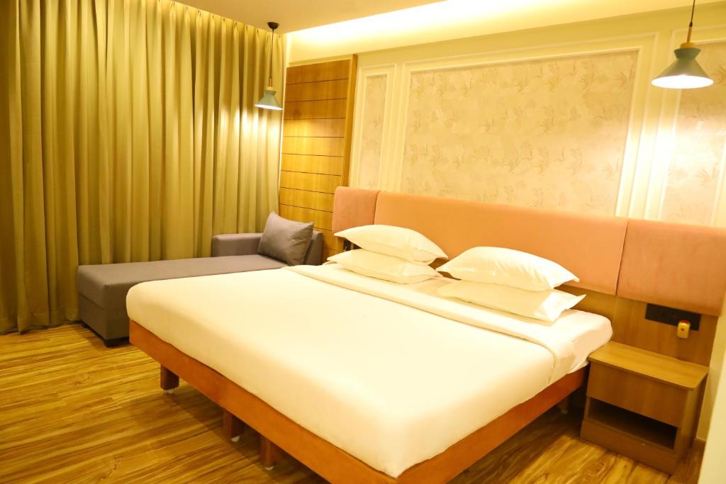 Postel nebo postele na pokoji v ubytování Hotel Surguru