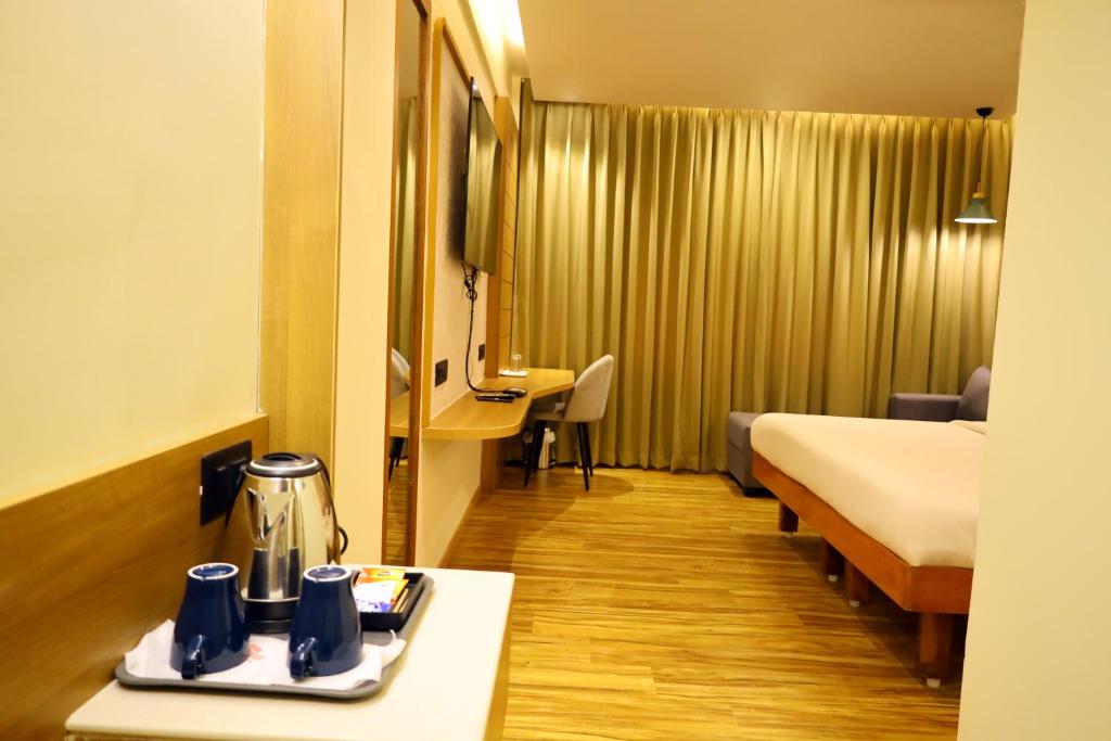 Postel nebo postele na pokoji v ubytování Hotel Surguru