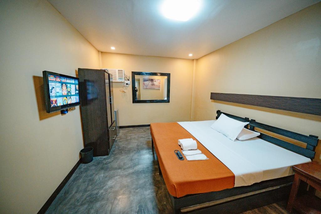 TV a/nebo společenská místnost v ubytování Piña Colina Resort