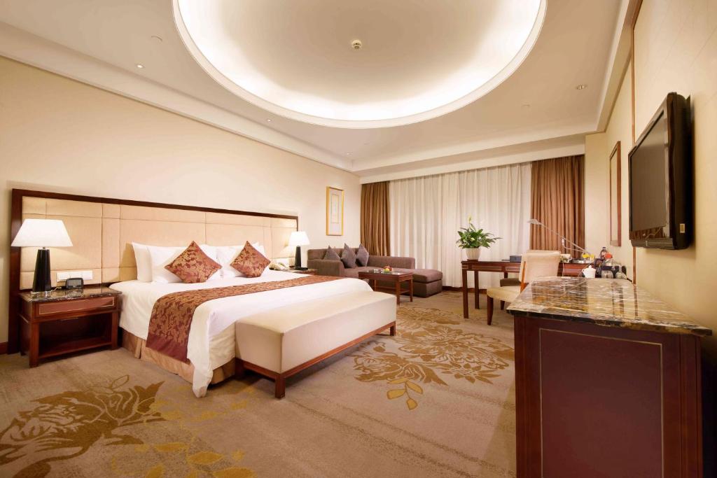 TV a/nebo společenská místnost v ubytování Shanghai Yuehua Hotel