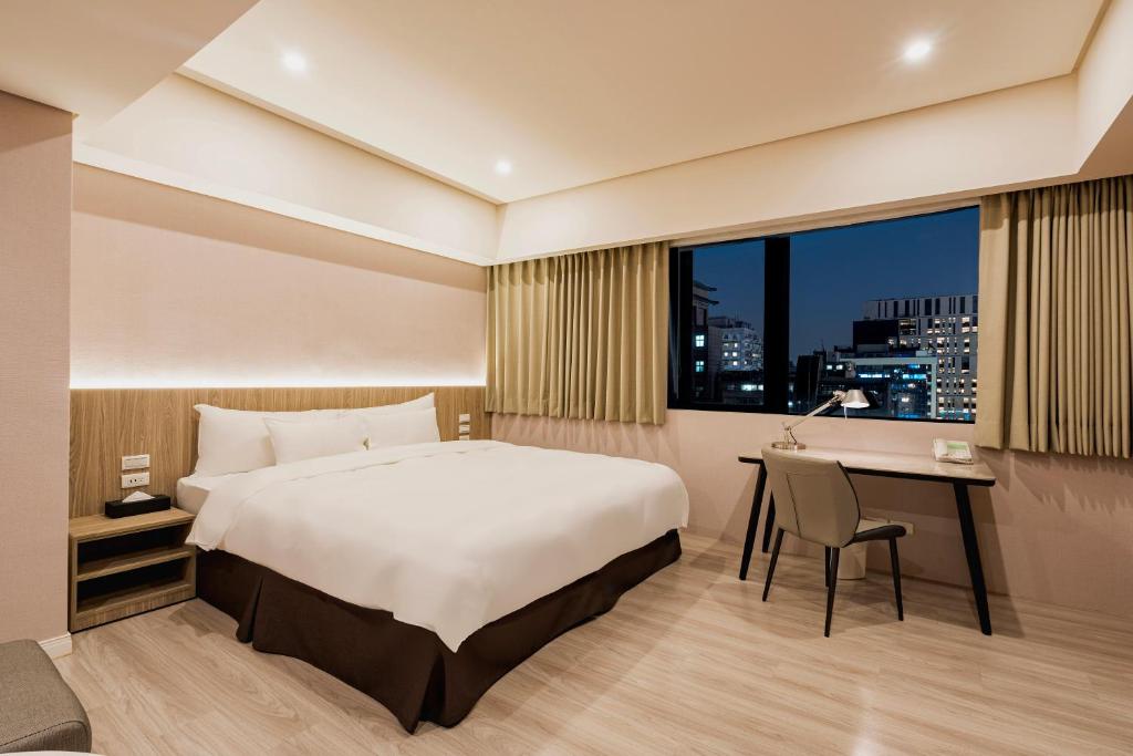 Postel nebo postele na pokoji v ubytování 家美瑞品 台北 - Jiamei Hotel