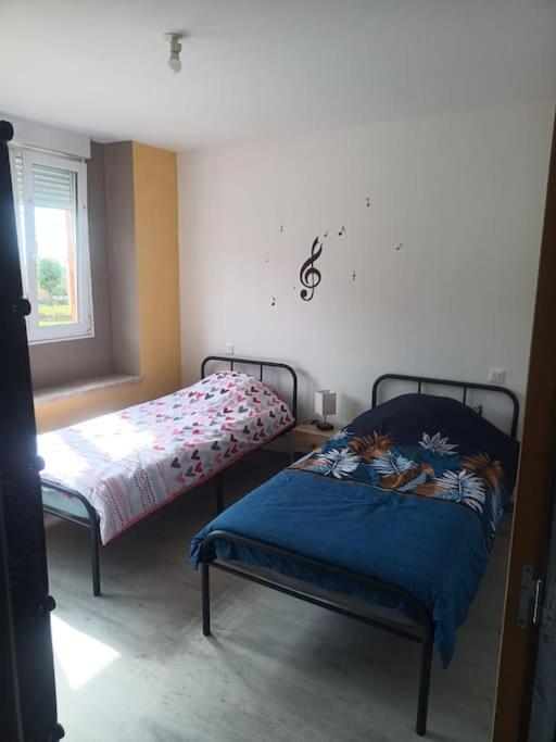 Postel nebo postele na pokoji v ubytování Appartement Volmunster
