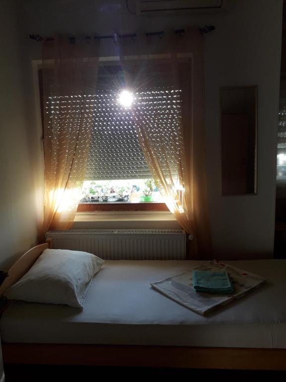 Postel nebo postele na pokoji v ubytování VILA NATALIJA APARTMANI