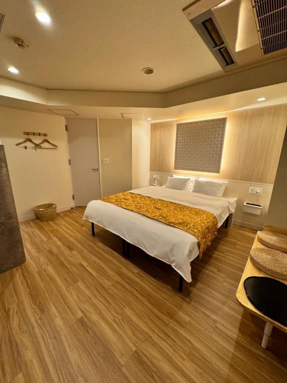 Postel nebo postele na pokoji v ubytování Hotel Be-zen shimanouchi