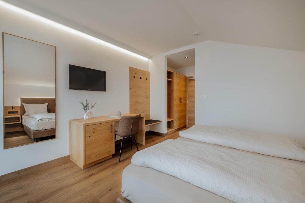 Postel nebo postele na pokoji v ubytování Garni-Hotel Farmerhof