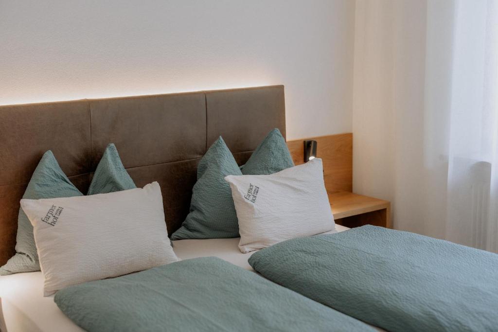 Postel nebo postele na pokoji v ubytování Garni-Hotel Farmerhof