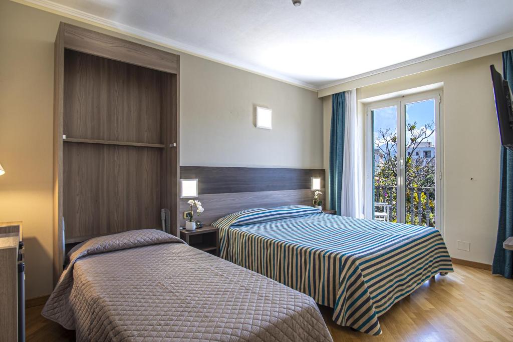 Кровать или кровати в номере Grande Albergo
